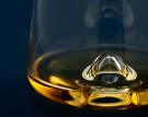 Whiskey_Glass_Blue_Backg_Closeup_120910